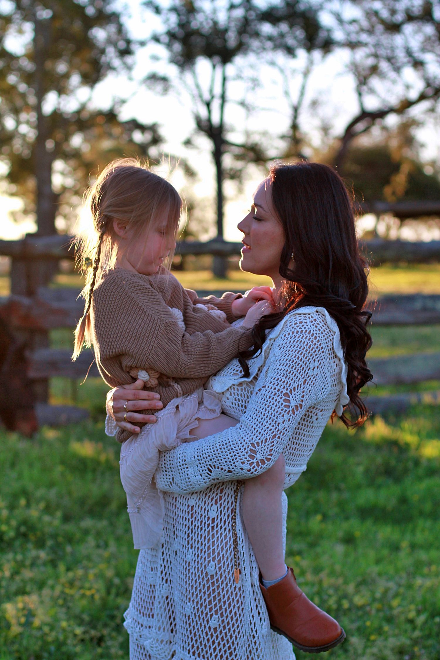 Emotional moment of mum holding daughter face to face during a family session