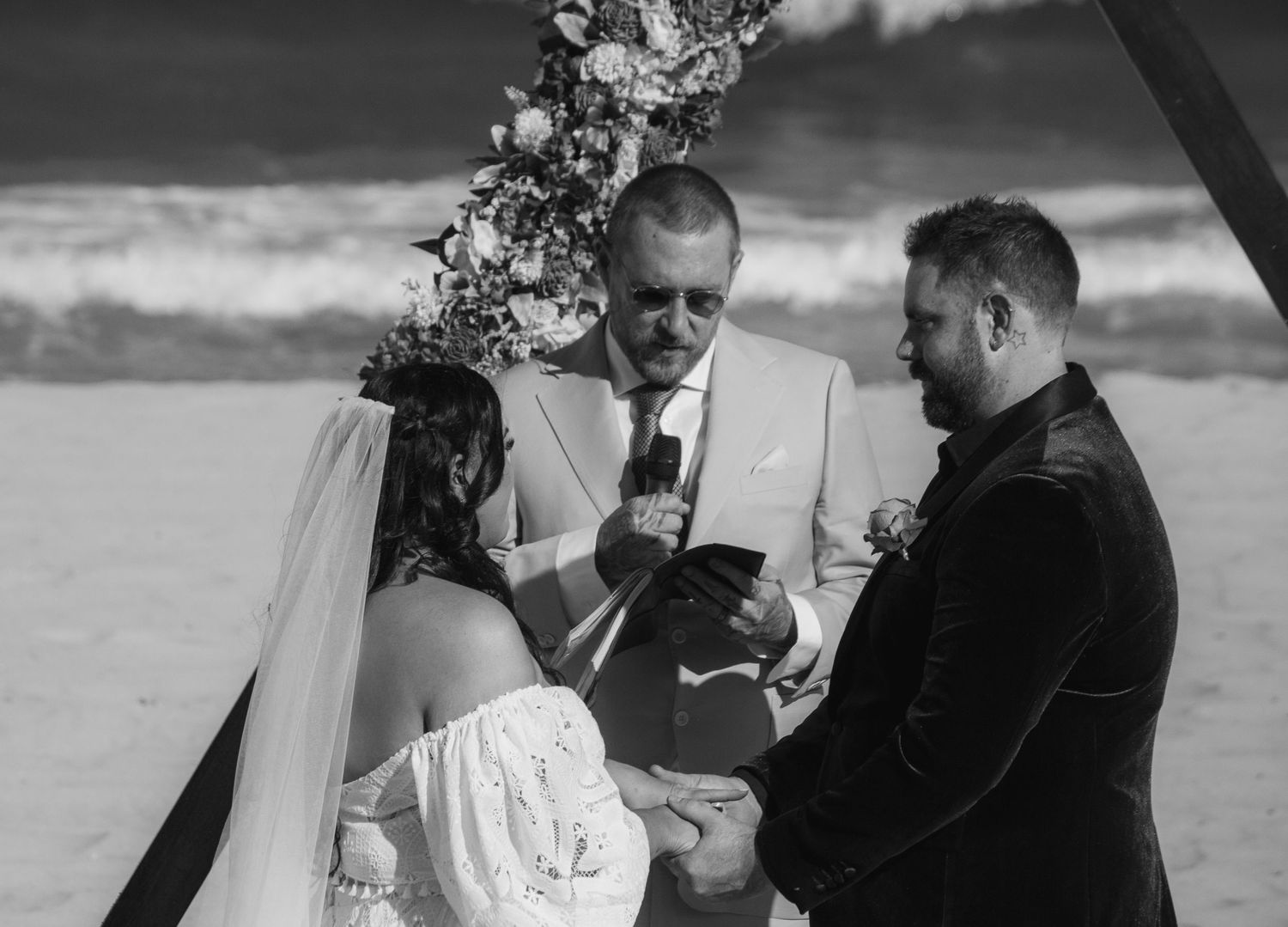 Intimate beach wedding in Wollongong with a couple exchanging vows by the ocean.