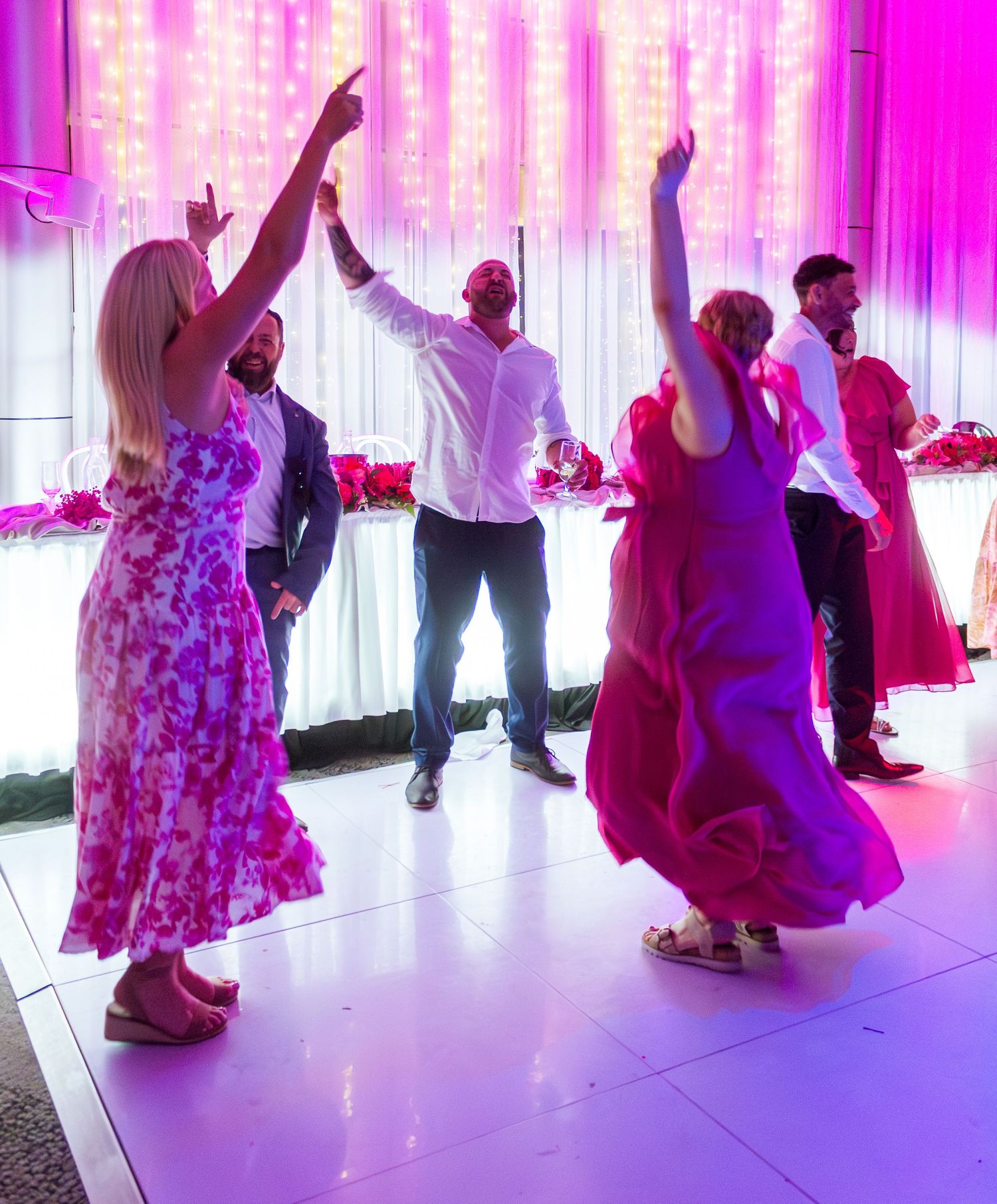 Guests celebrating on the dance floor at the wedding reception, fun party moments with friends and family taken in the Illawarra.