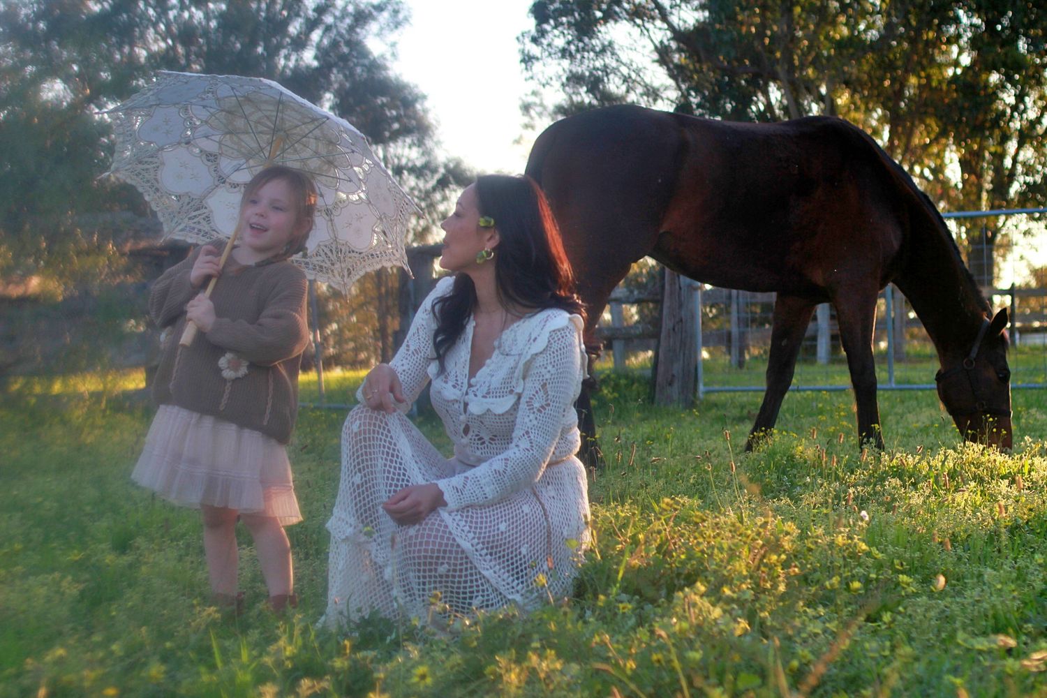 Mum and daughter sharing a quiet moment in nature during a family session