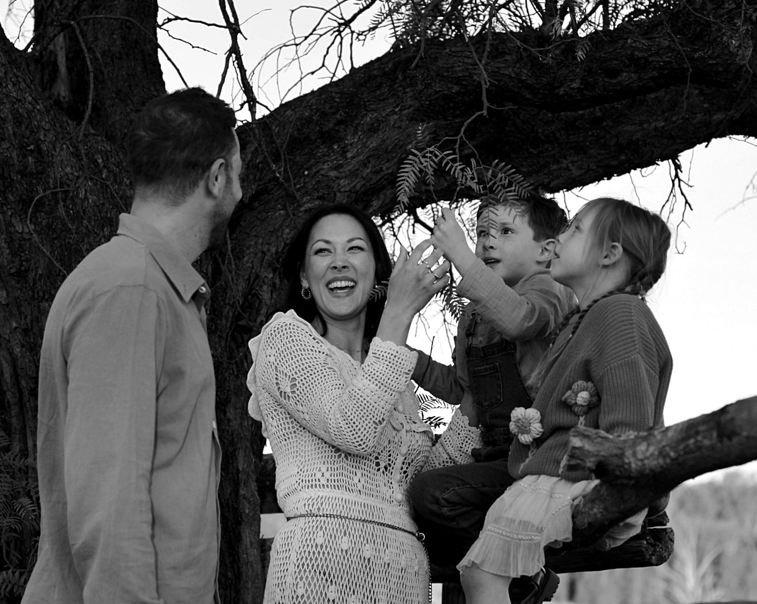 Candid portrait during a family session of family together in the countryside