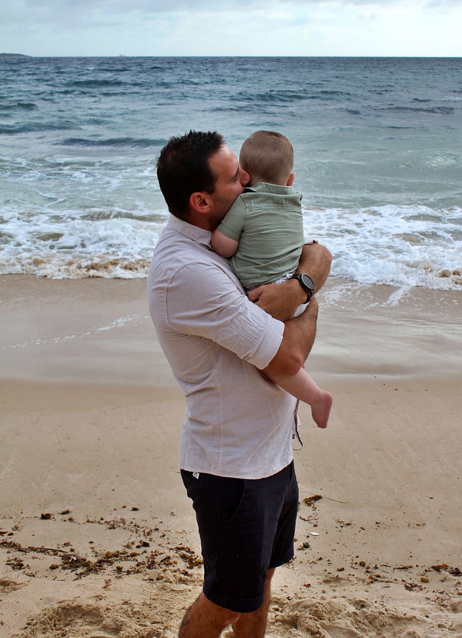 Dad and son portraits on the beach in the Illawarra, capturing loving connection and natural coastal moments.