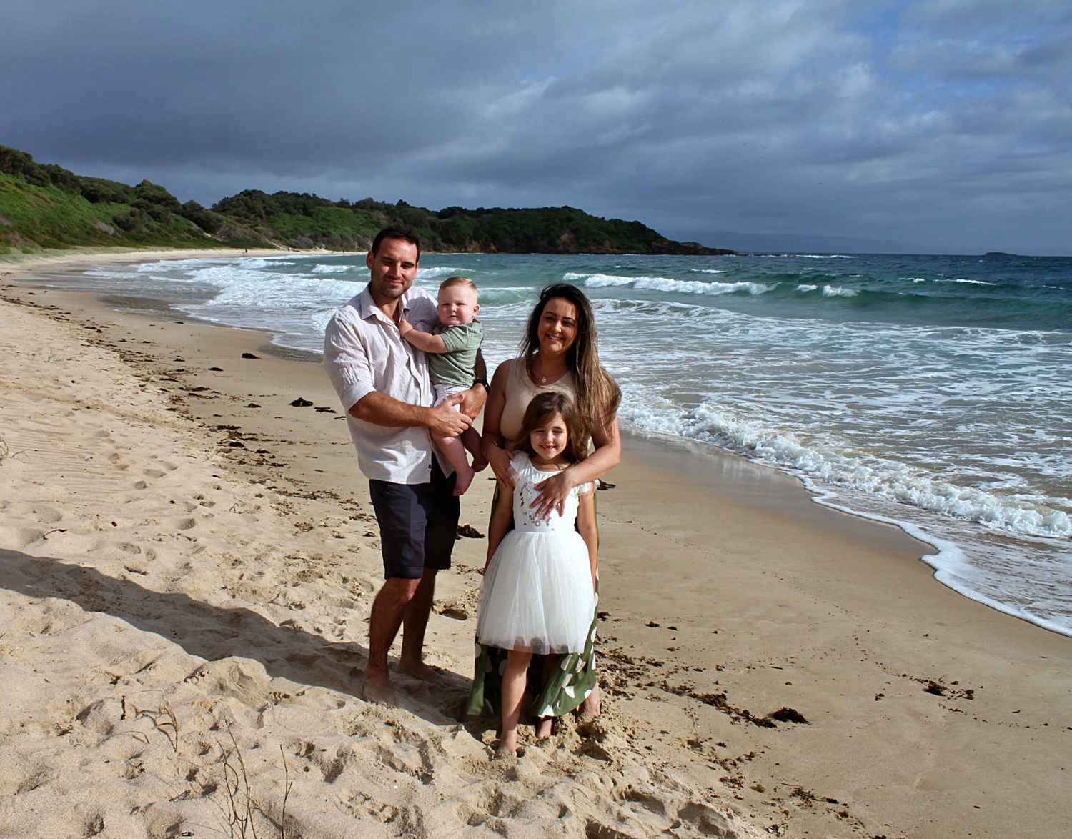 Family portraits by the sea in the Illawarra, documenting genuine moments and timeless beachside connection.