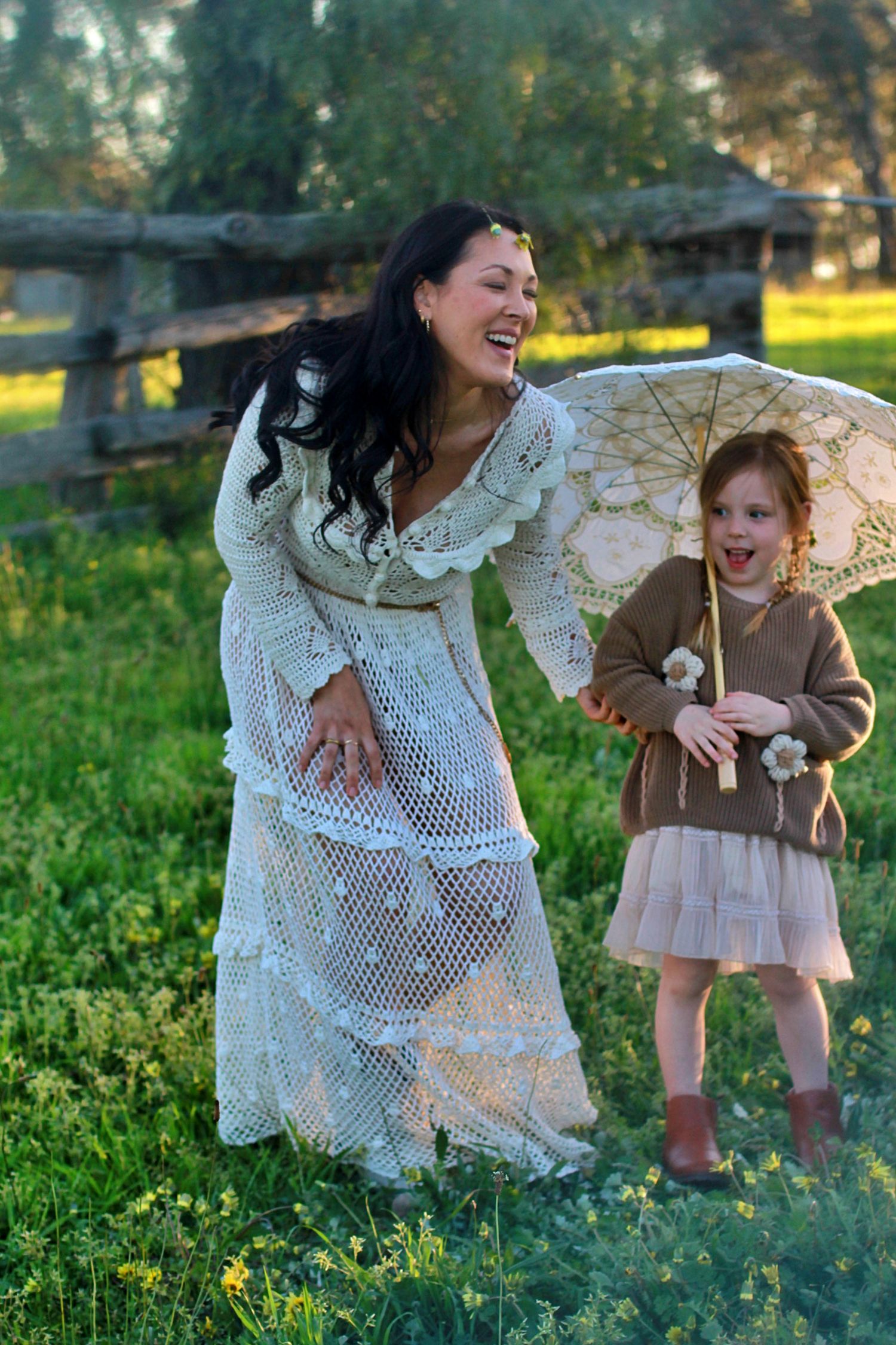A candid moment where mum is laughing with daughter during family session