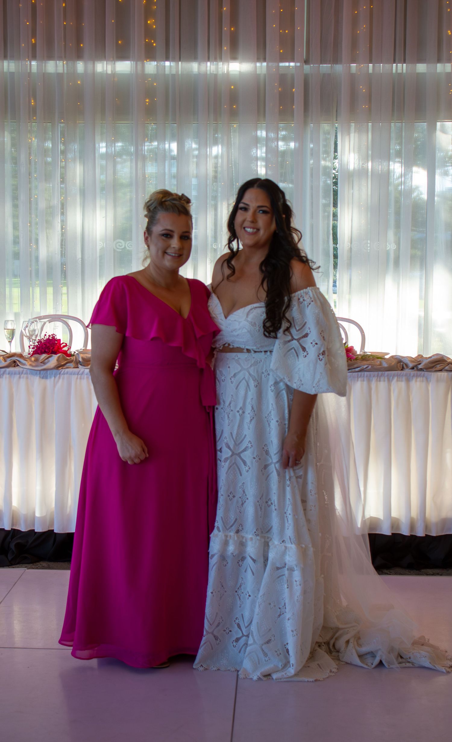 Portrait of the bride with her bridesmaid during wedding portraits, celebrating friendship on the wedding day.