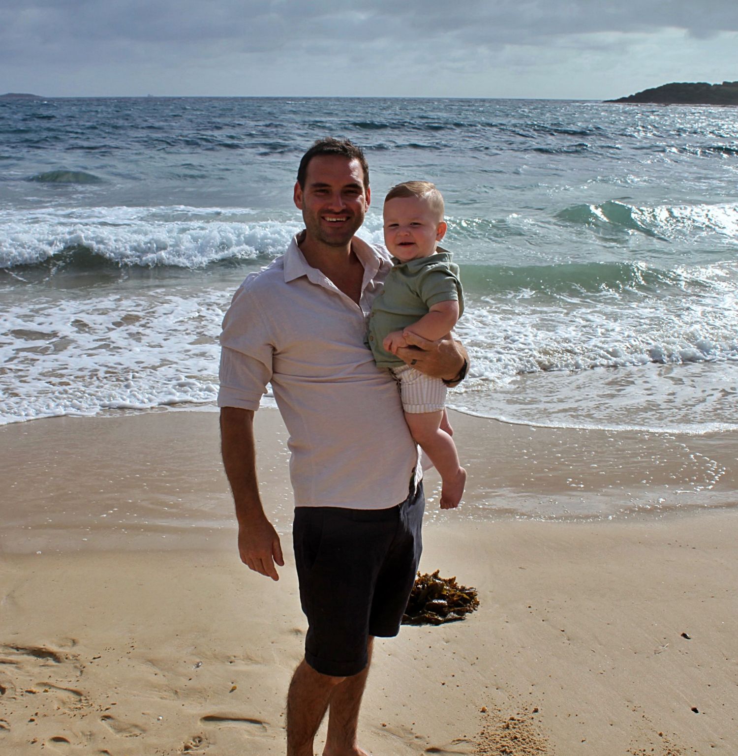 Dad and son portraits on the beach in the Illawarra, capturing loving connection and natural coastal moments.
