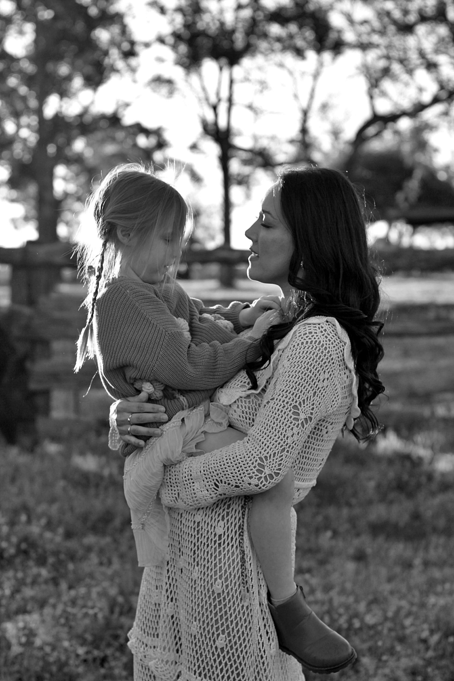 Emotional moment of mum holding daughter face to face during a family session