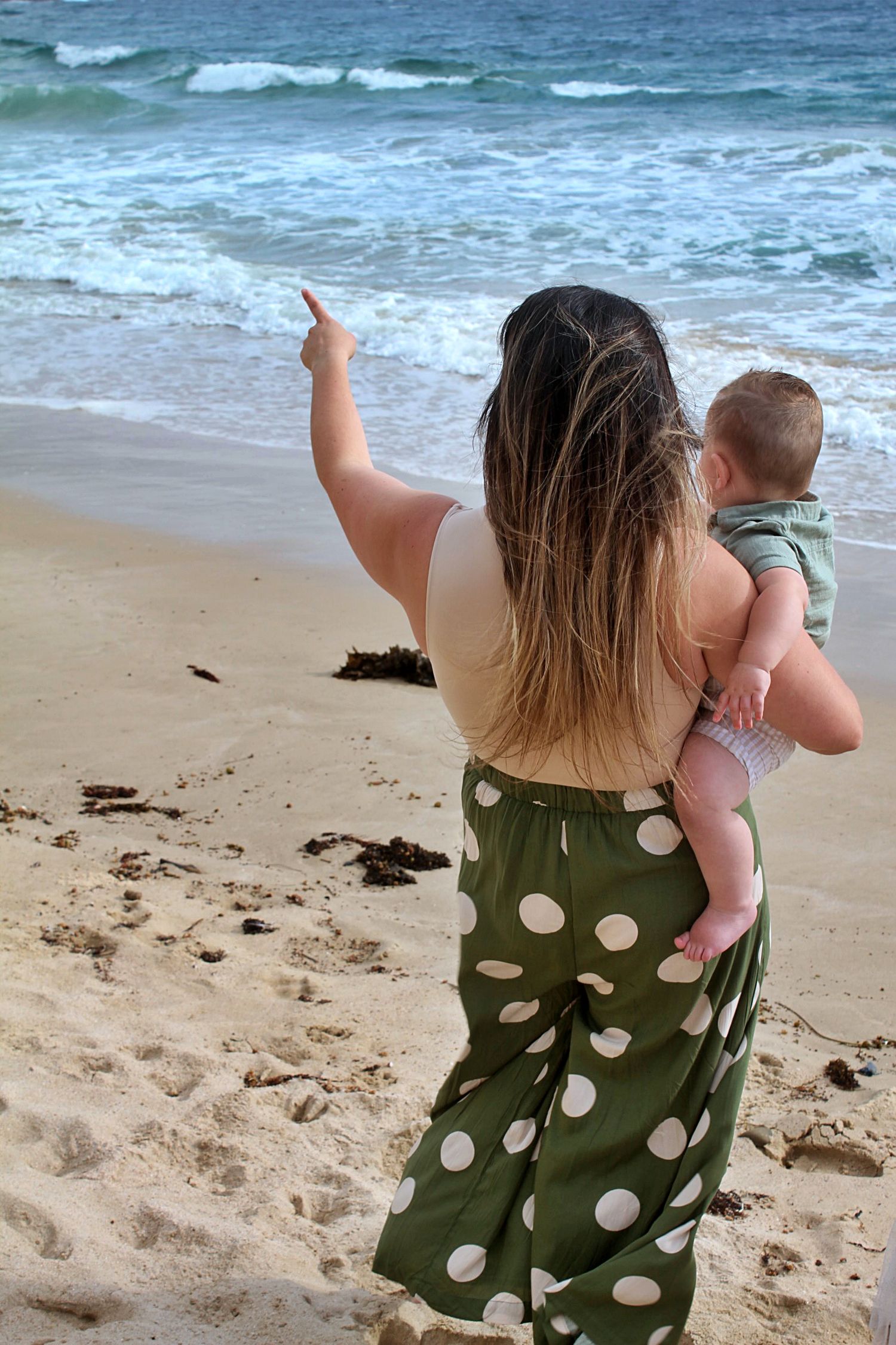 Candid mum and son portraits on the beach in the Illawarra, capturing tenderness and natural family connection
