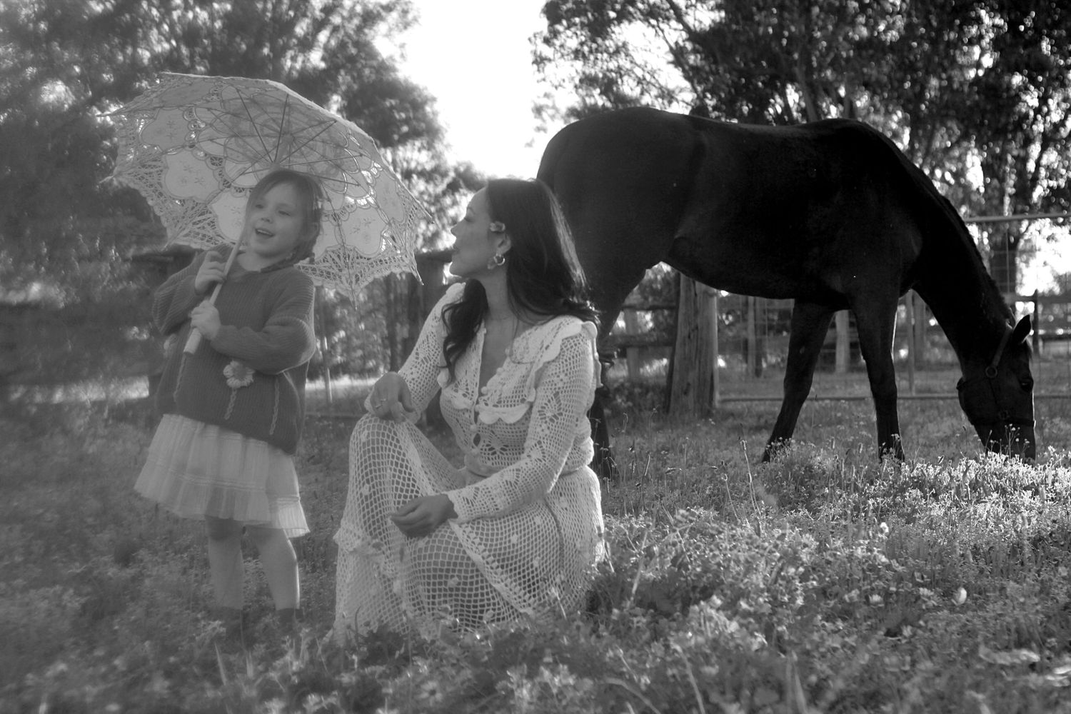 Mum and daughter sharing a quiet moment in nature during a family session