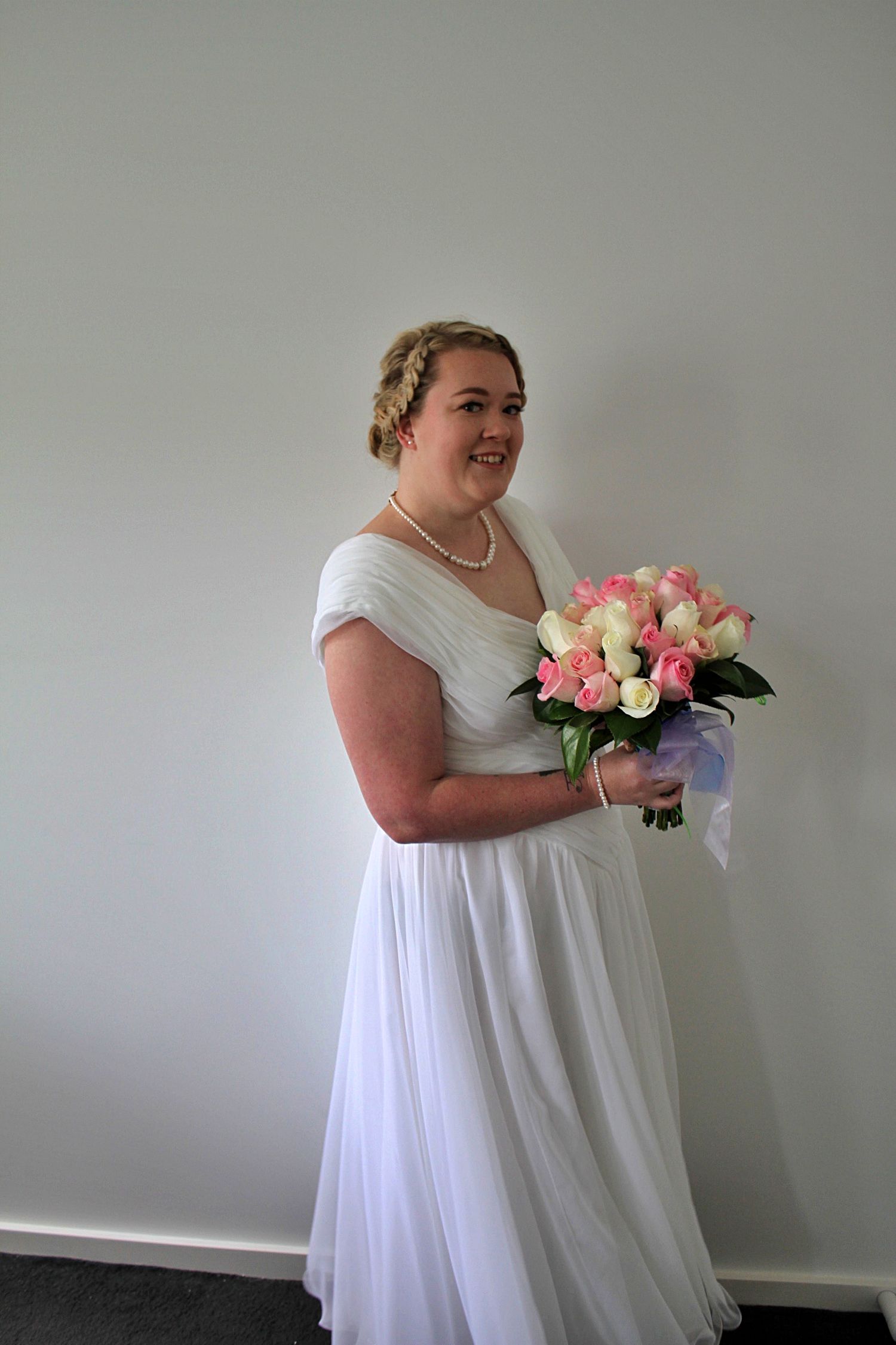 Bride portrait with hair and makeup finished, dress  and bouquet during a micro wedding in the Illawarra.