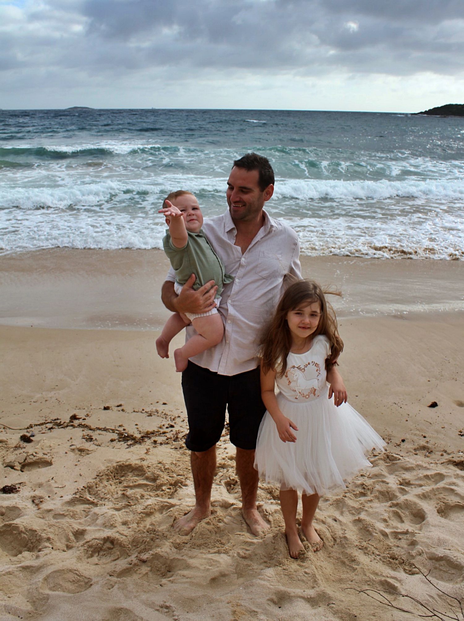 Natural beach portraits of dad with his daughter and son in the Illawarra.