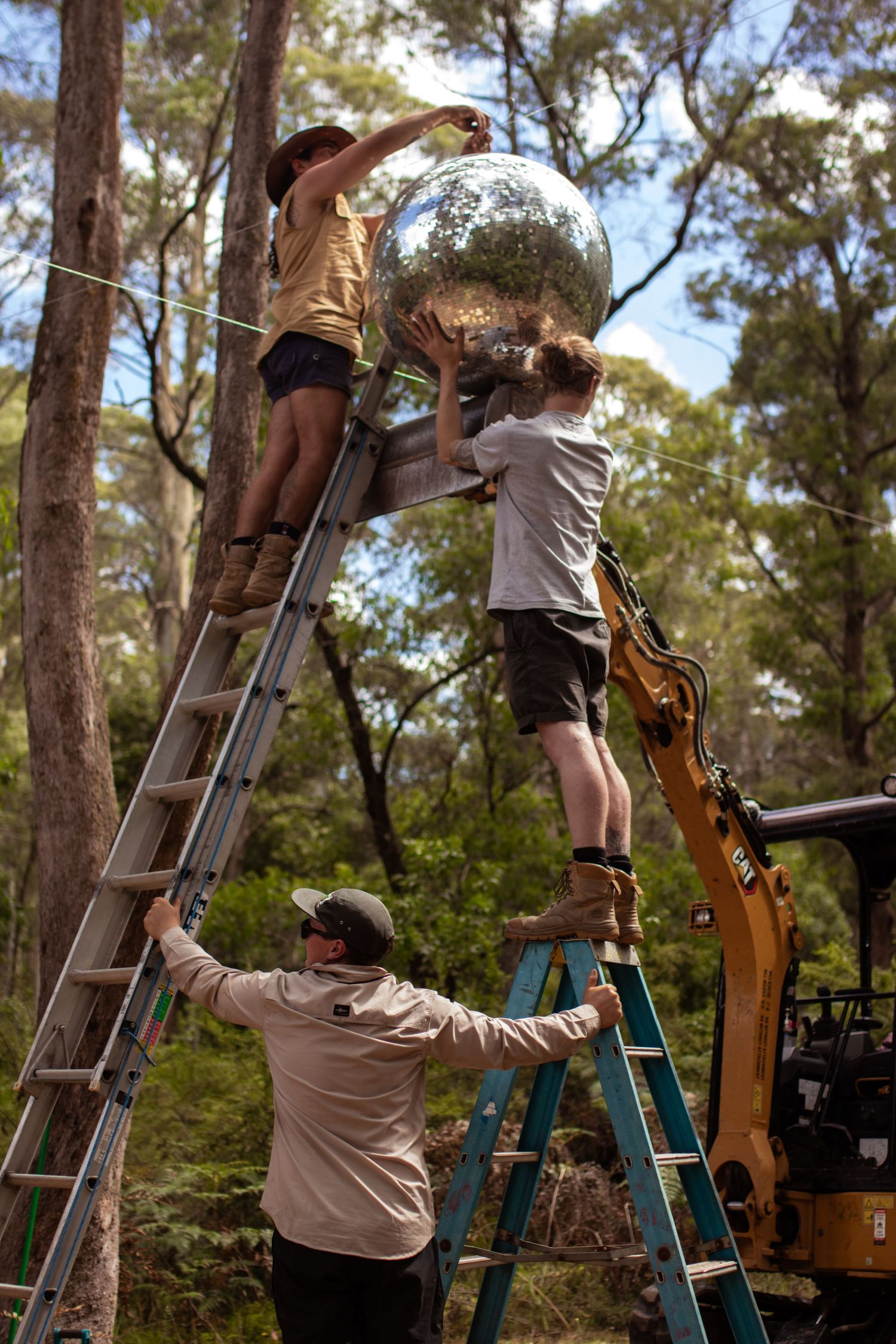 setting up a giant disco ball