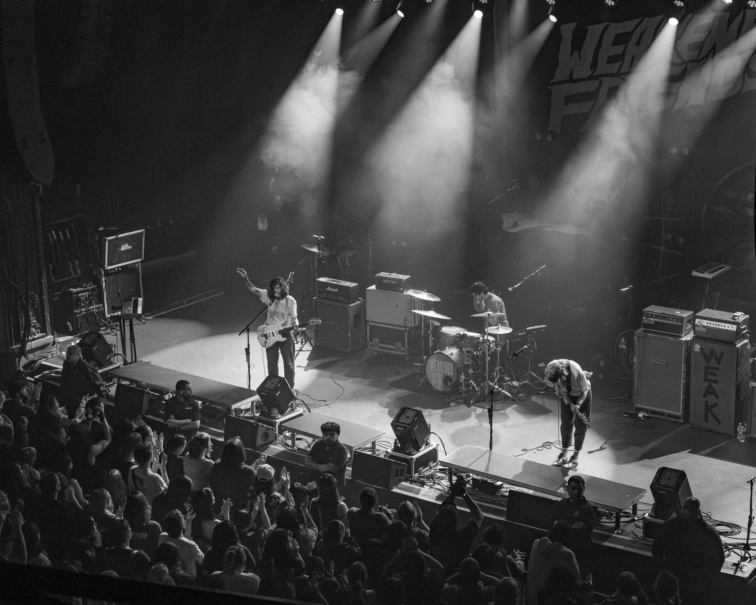 Black-and-white concert photograph of Weakened Friends performing at the Riviera Theatre in Chicago.