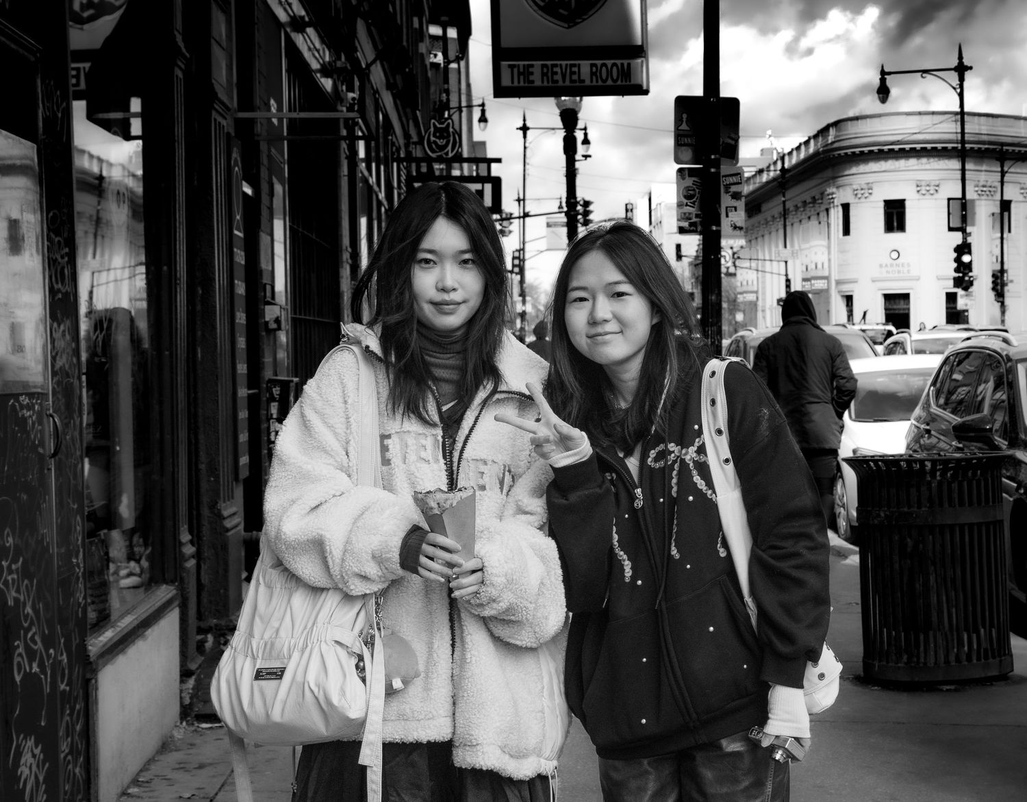 Black-and-white street portrait of two women in Chicago’s Wicker Park neighborhood.