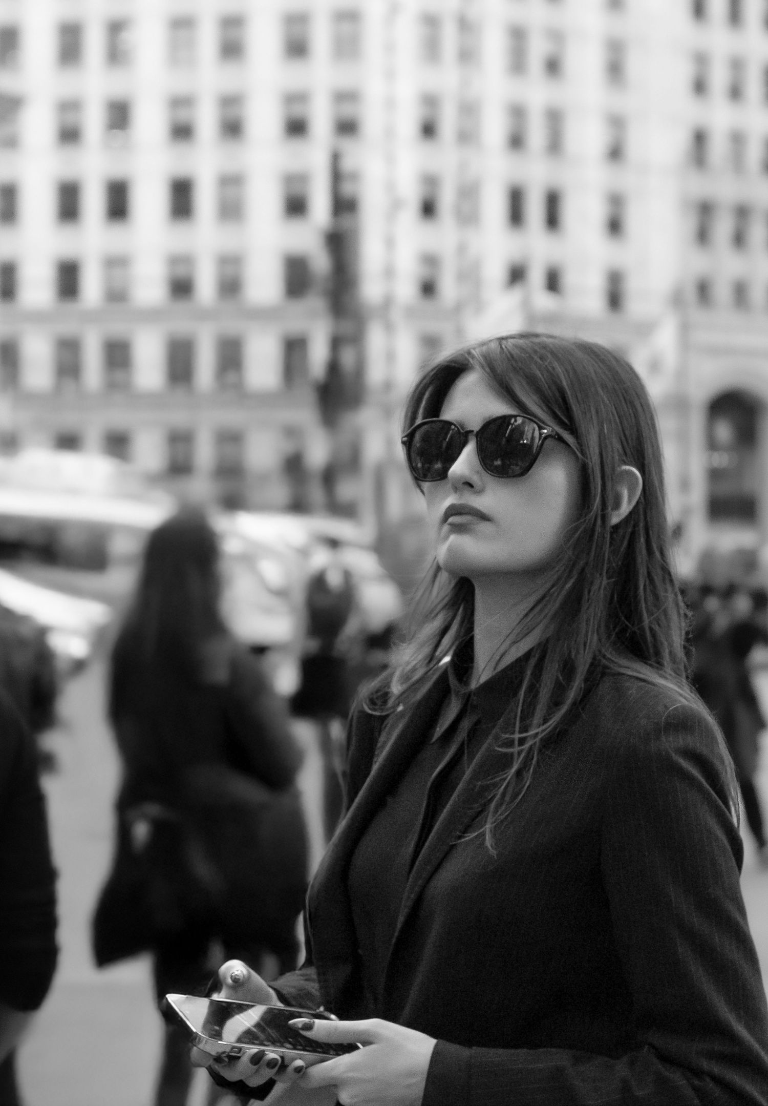 Black-and-white street portrait of a woman in downtown Chicago, Illinois.