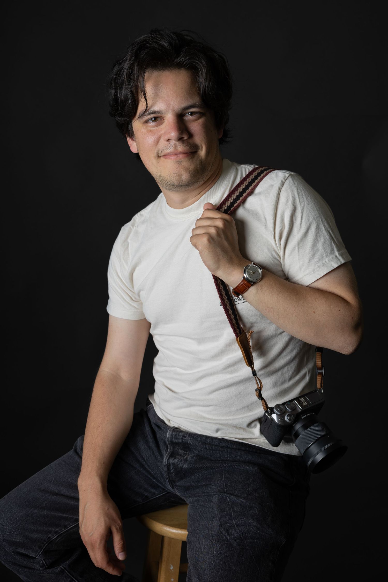 Studio portrait of a professional photographer in a creative photography studio.