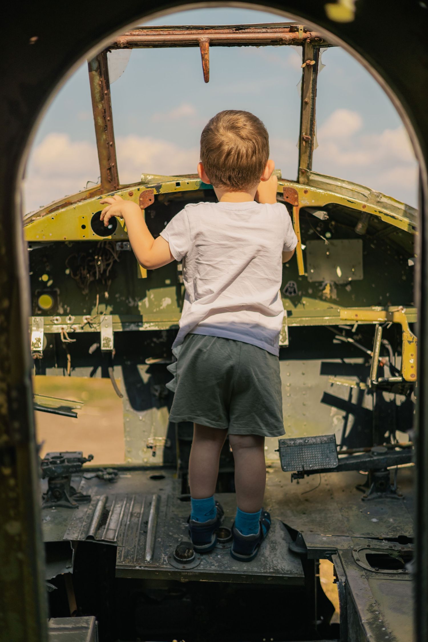 Kid inside an old airplane
