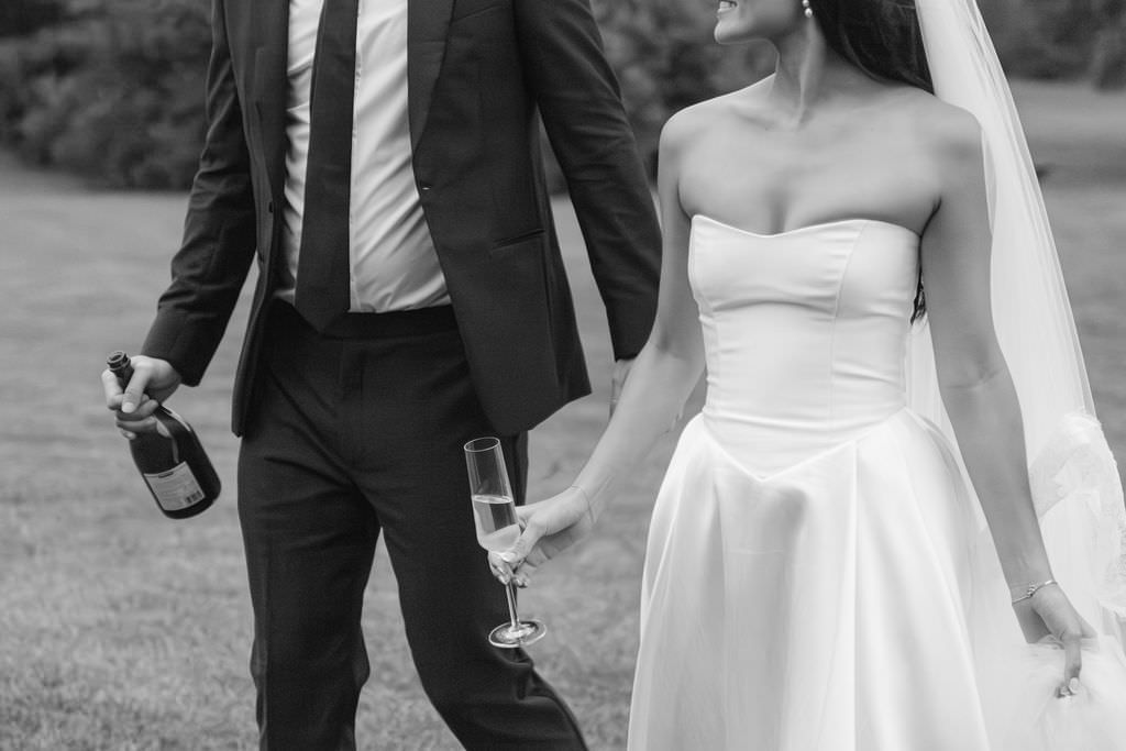 Wedding couple champagne photographed by Michigan photographer Kayla Raquel Photo.