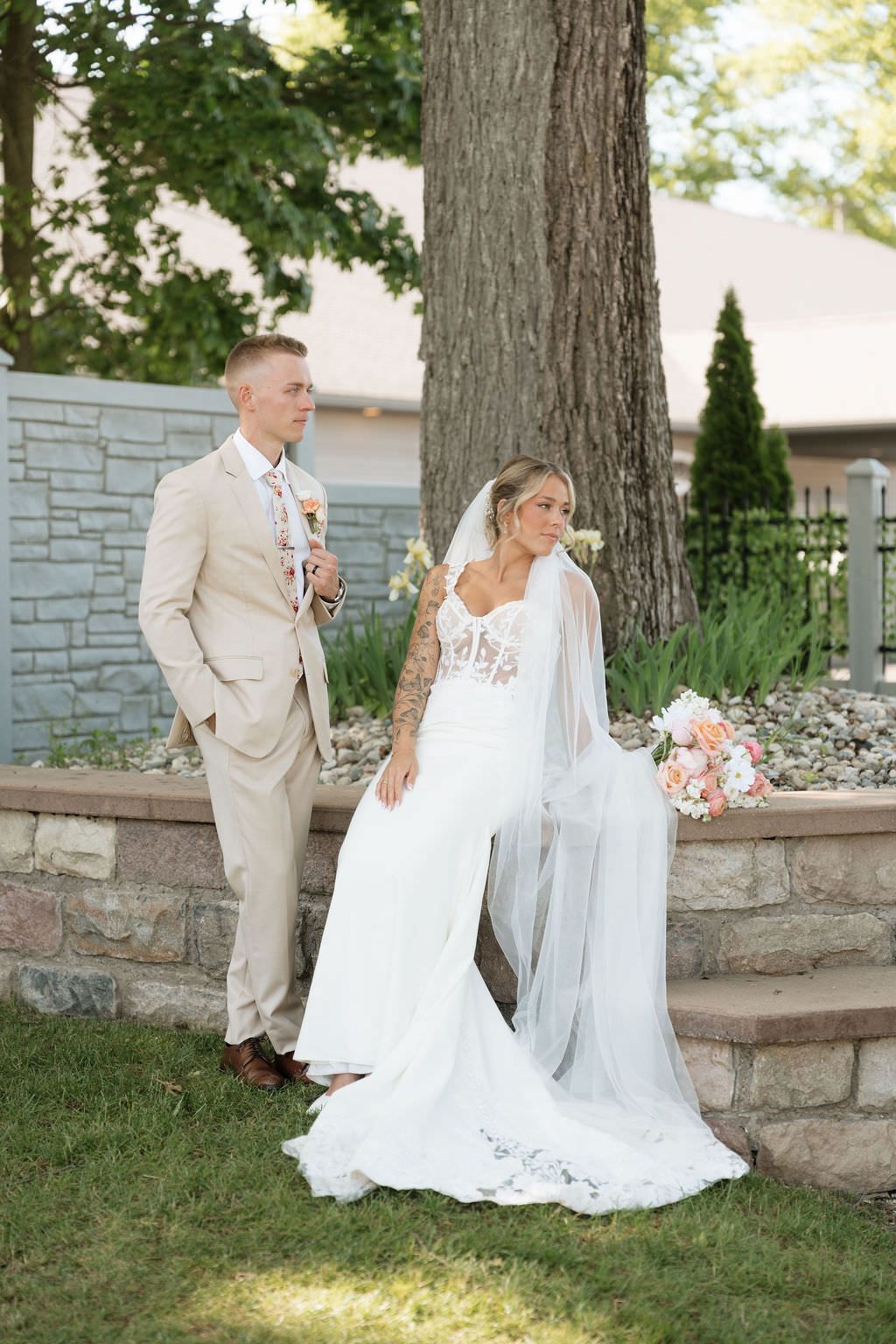 Couple's editorial posing Michigan wedding photographer directs bride and groom