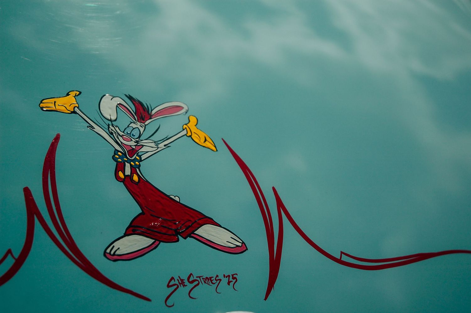 Roger Rabbit cartoon character custom airbrush artwork painted on a turquoise car panel.