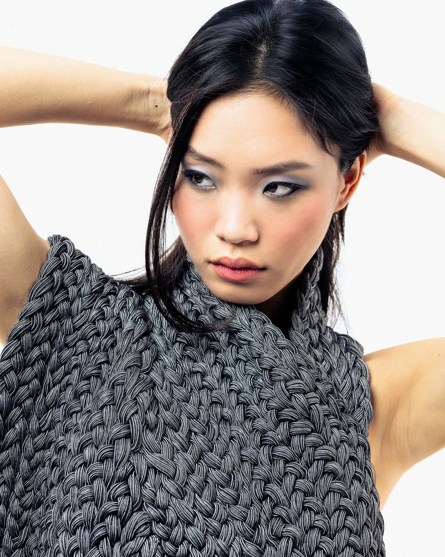Girl with striking pose and knitted top