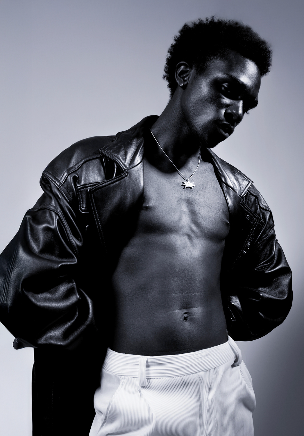Male in leather jacket and black and white image