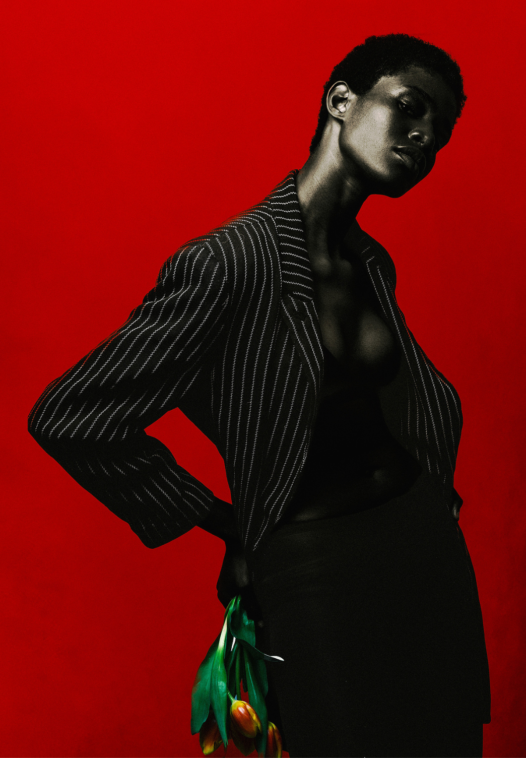 Woman wearing pinstripe blazer in editorial style editing