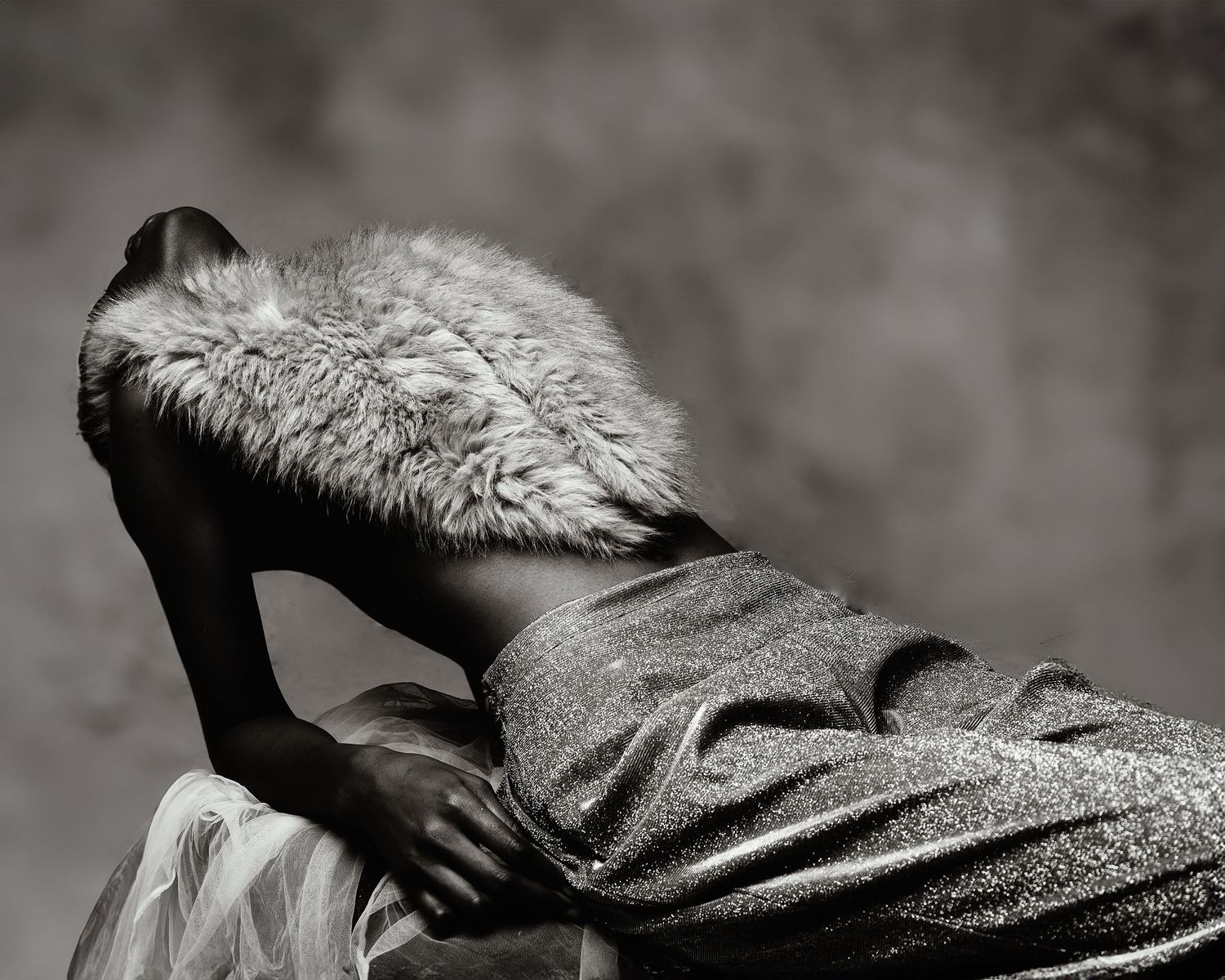 Woman in a fur scarf, black and white image in creative composition