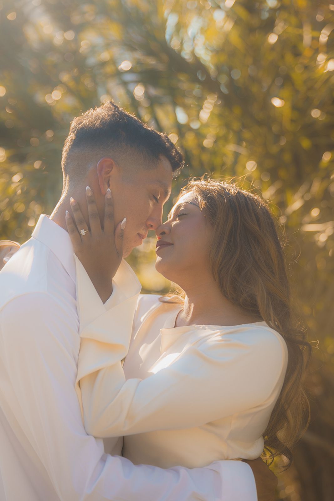 Close-up of a couple embracing with the woman touching the man's face