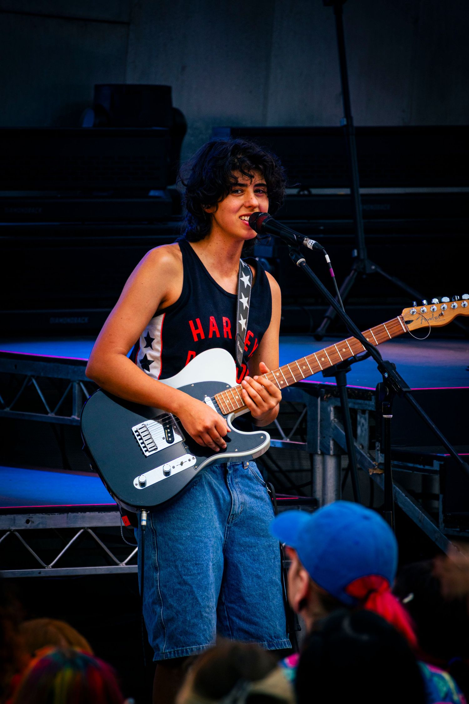 Musician playing guitar during Melbourne live event