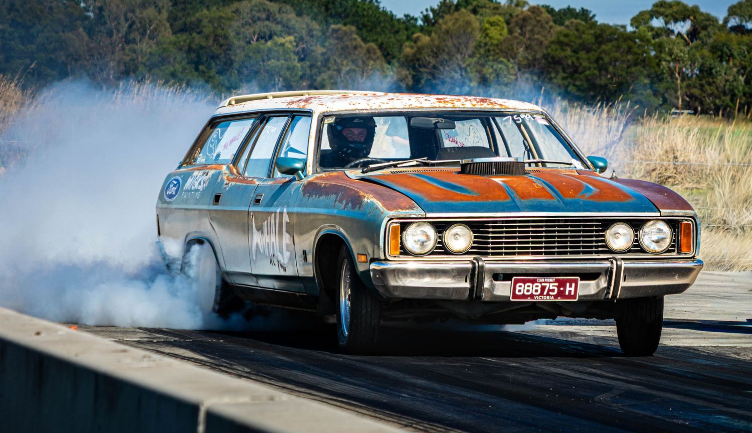 Classic wagon performing a burnout with smoke at Ballarat drag strip