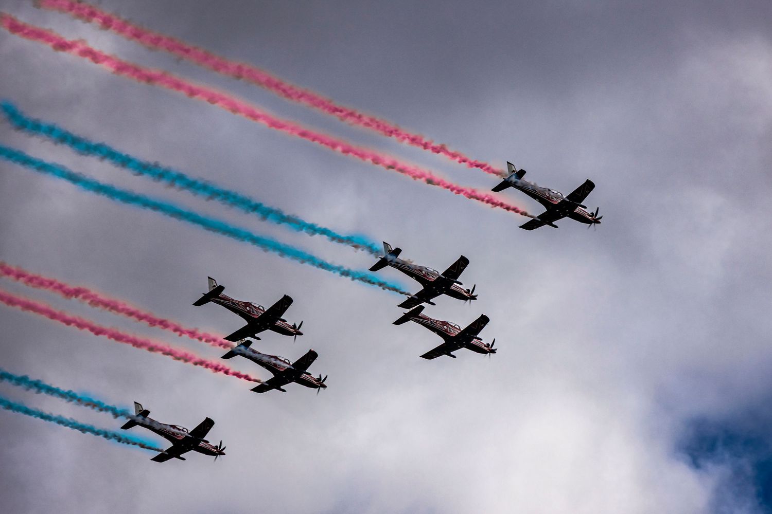 Formation flying display at Melbourne airshow with coloured smoke