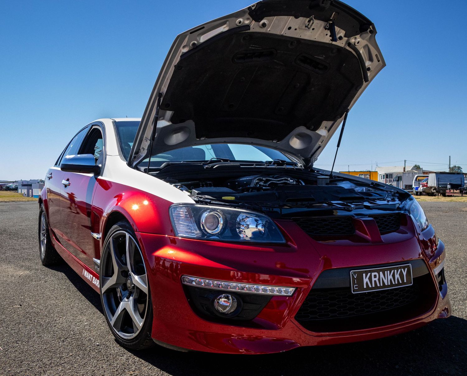 Automotive detail of red car engine bay during track day in Ballarat
