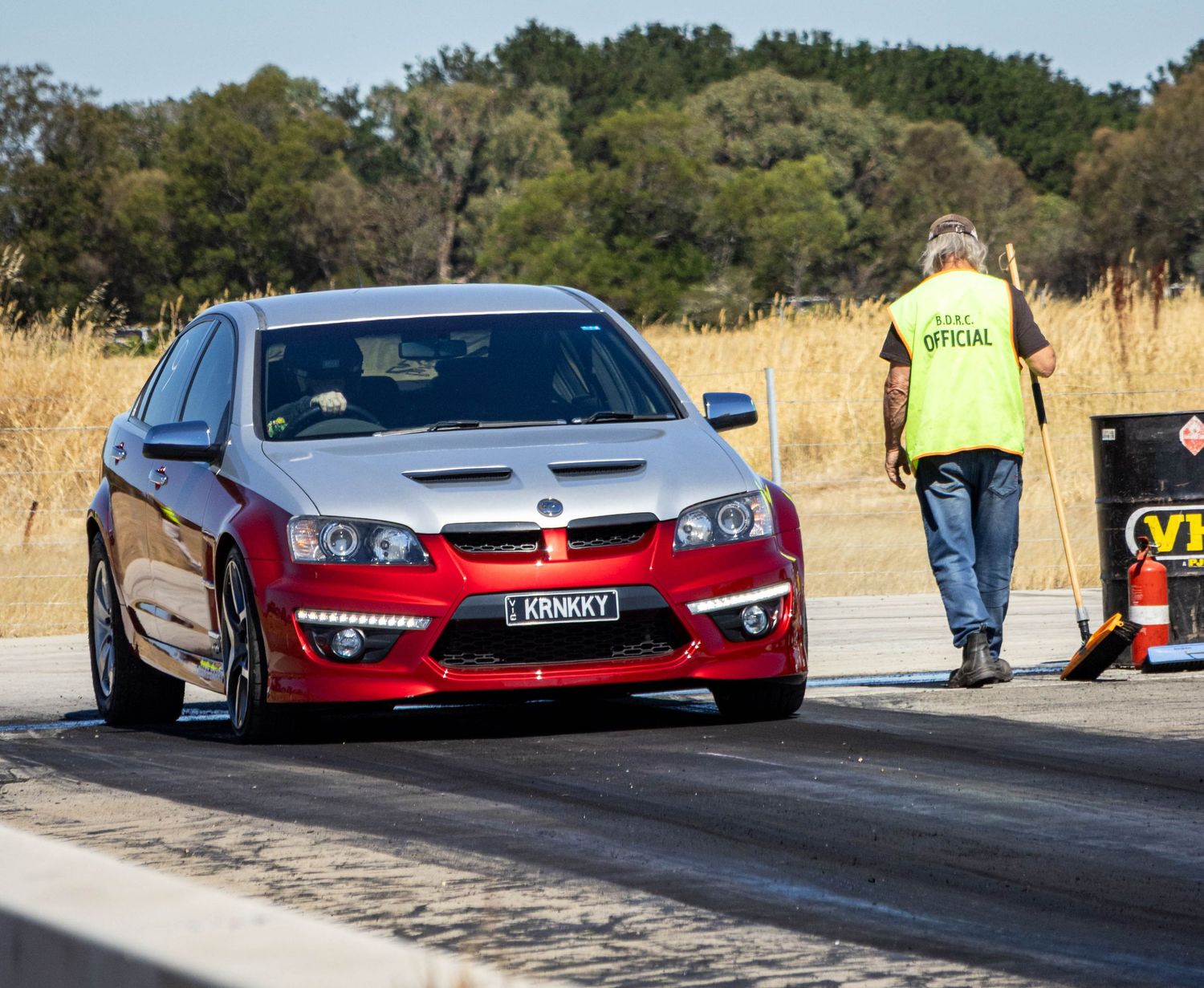 Drag racing action with red Commodore at Ballarat track