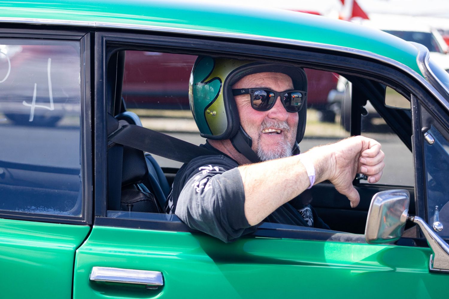 Candid moment of driver preparing to race inside Holden Torana