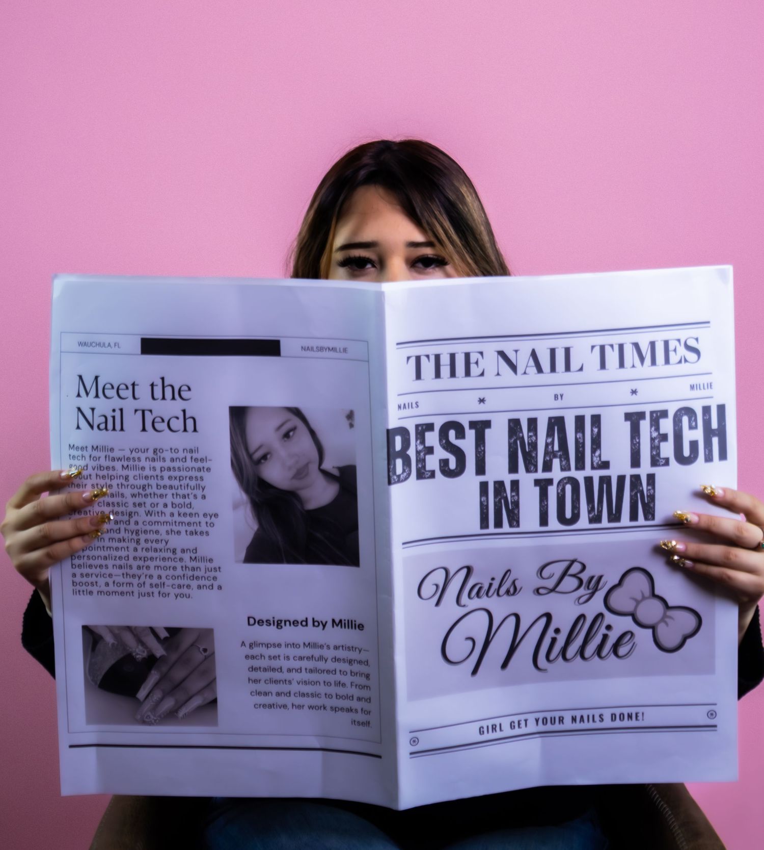 Woman holding The Nail Times newspaper featuring Nails By Millie Best Nail Tech in Town headline.