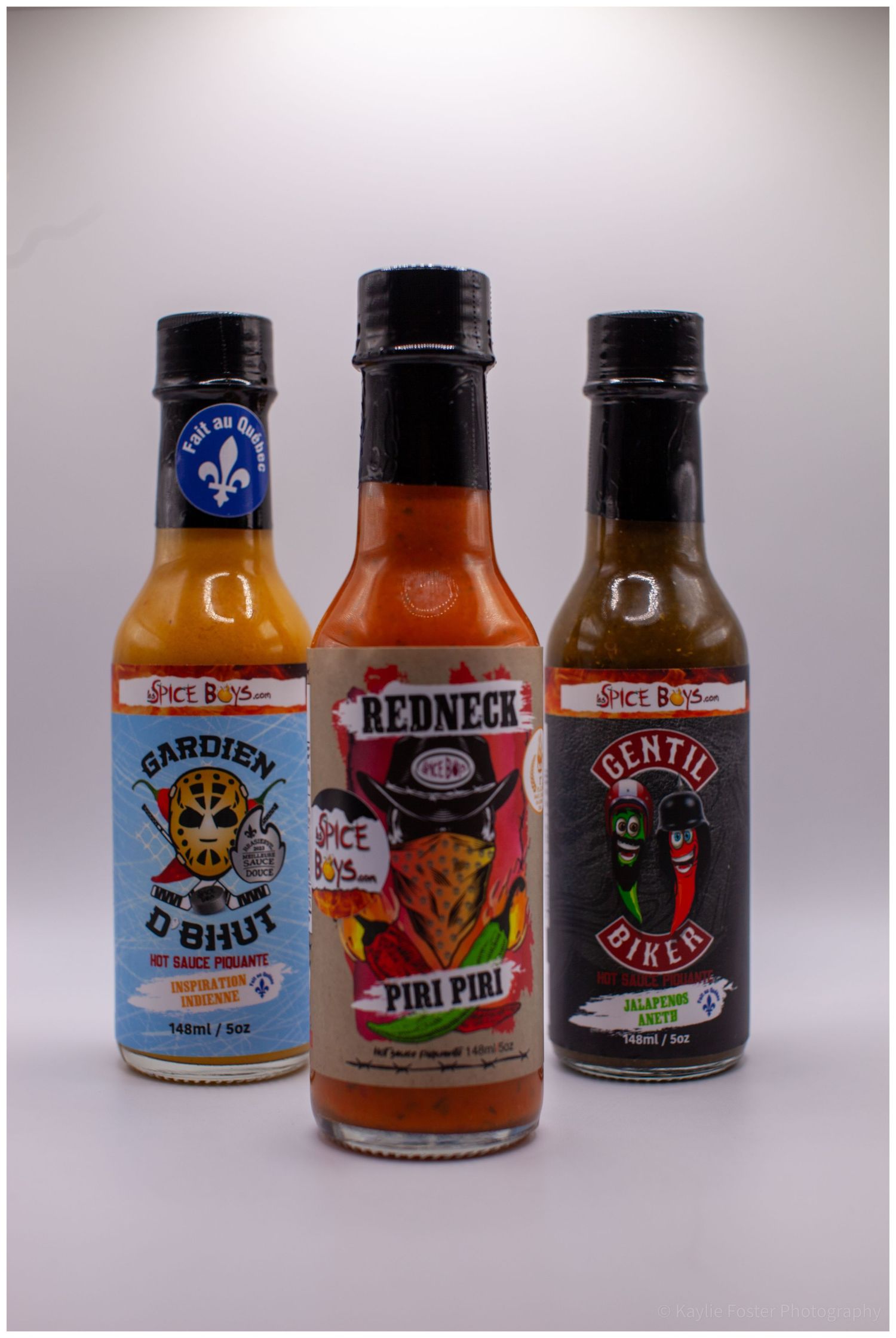 Three Spice Boys hot sauce bottles including Gardien D Bhut, Redneck Piri Piri, and Gentil Biker.