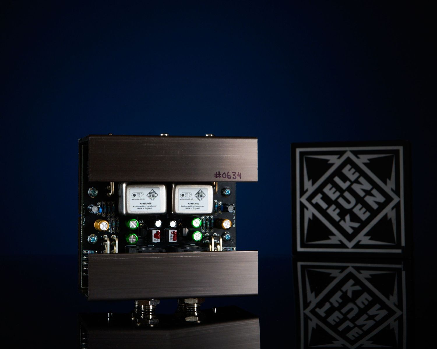 Telefunken BOLTS dual-channel audio preamp unit with illuminated meters on dark blue background.
