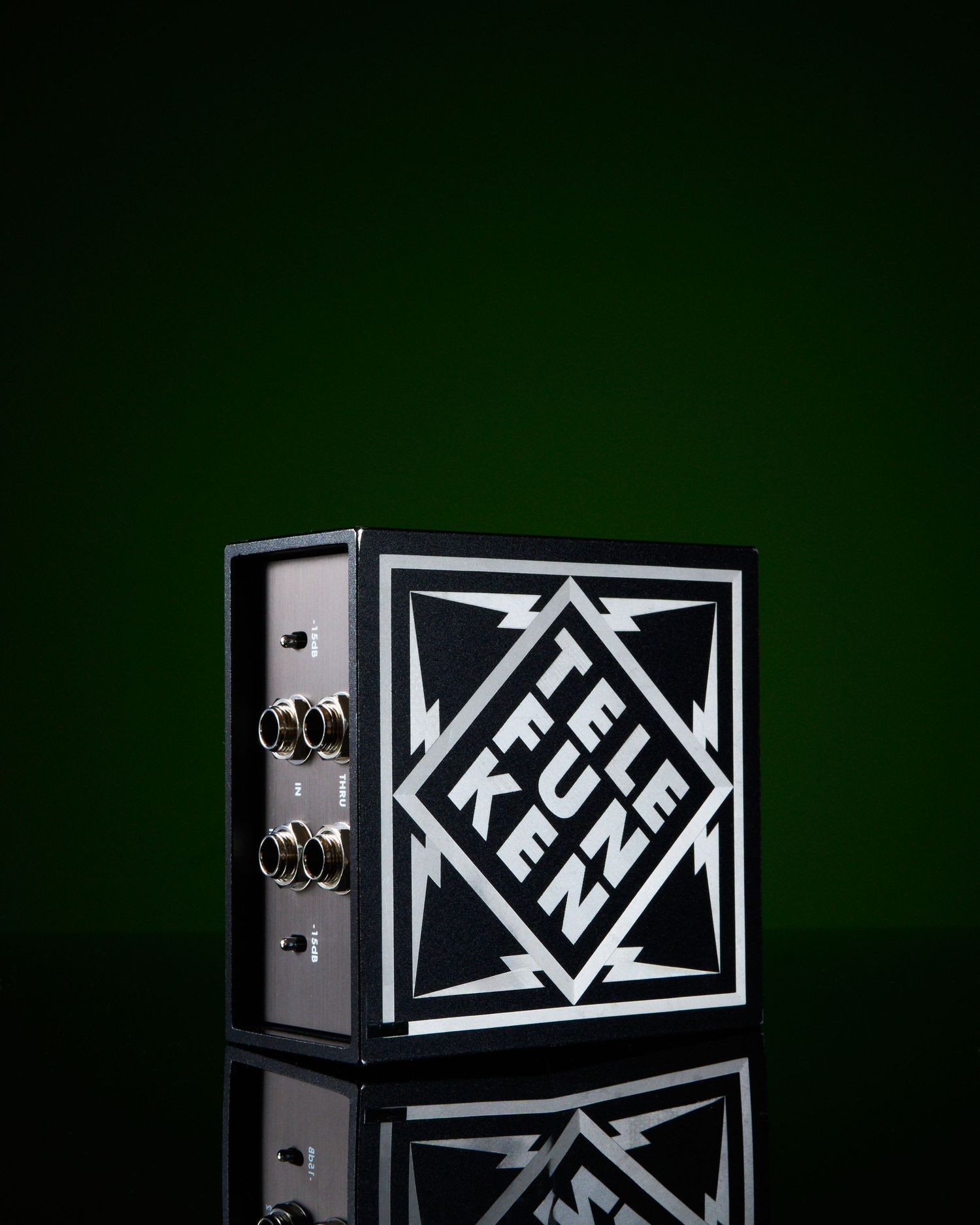 Telefunken TDA-2 DI box with classic black and white lightning bolt logo against a deep green background.