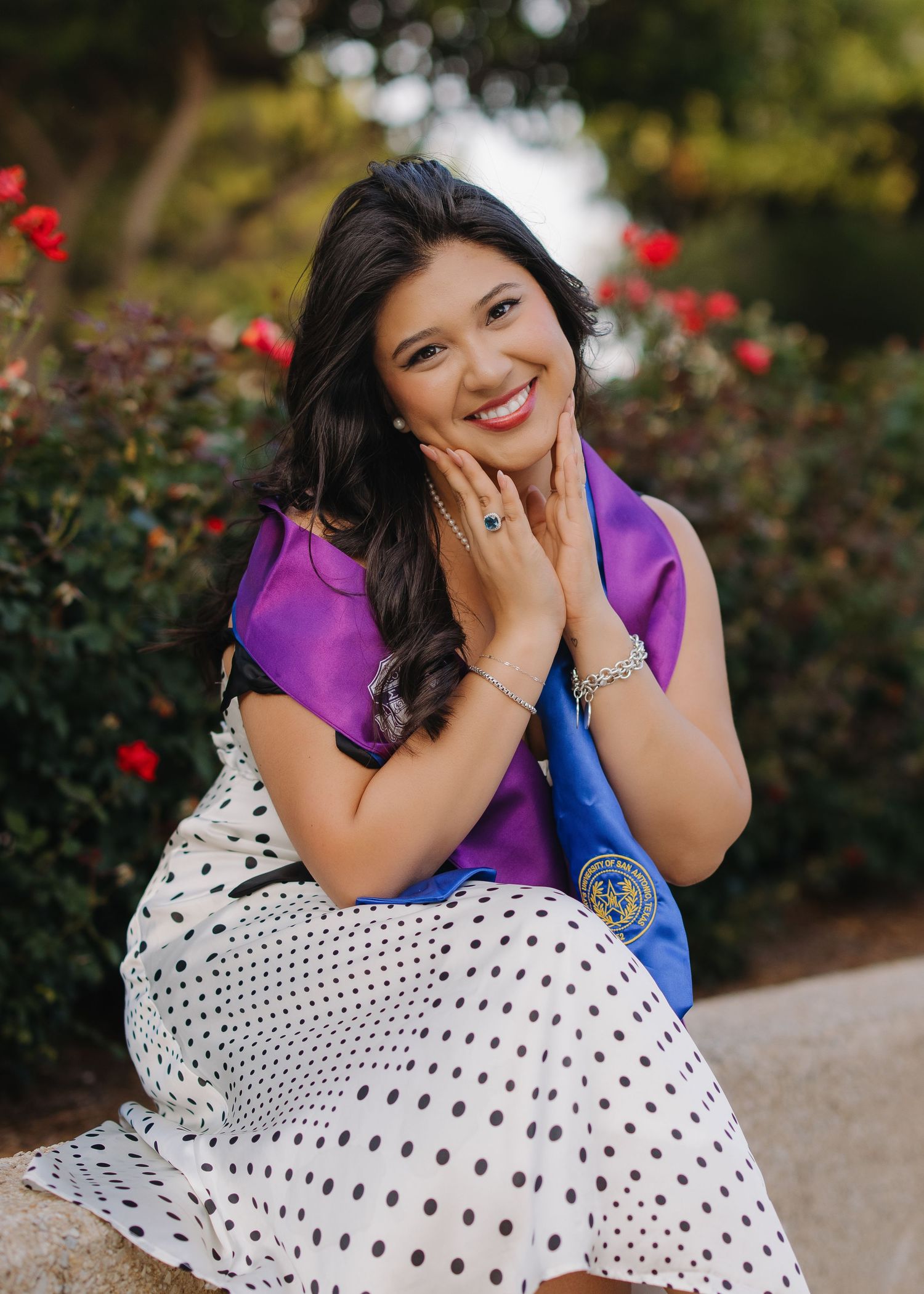 San Antonio senior photographer, graduate in rose garden at University of Incarnate Word, UIW