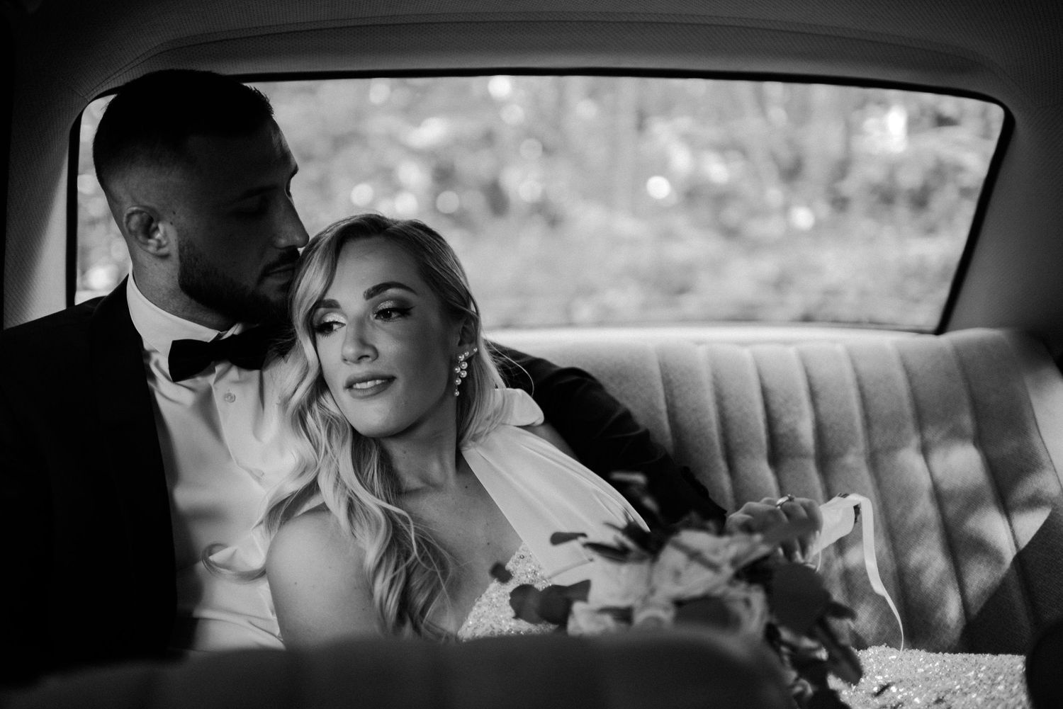 Intimate black and white moments captured inside a vintage car.