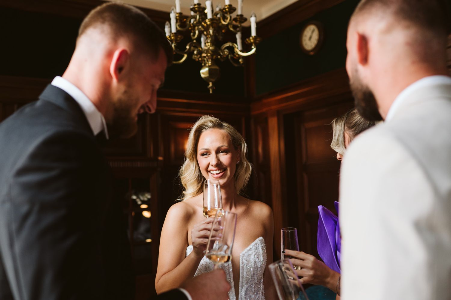 Wedding celebration scene with champagne and elegant formal attire.