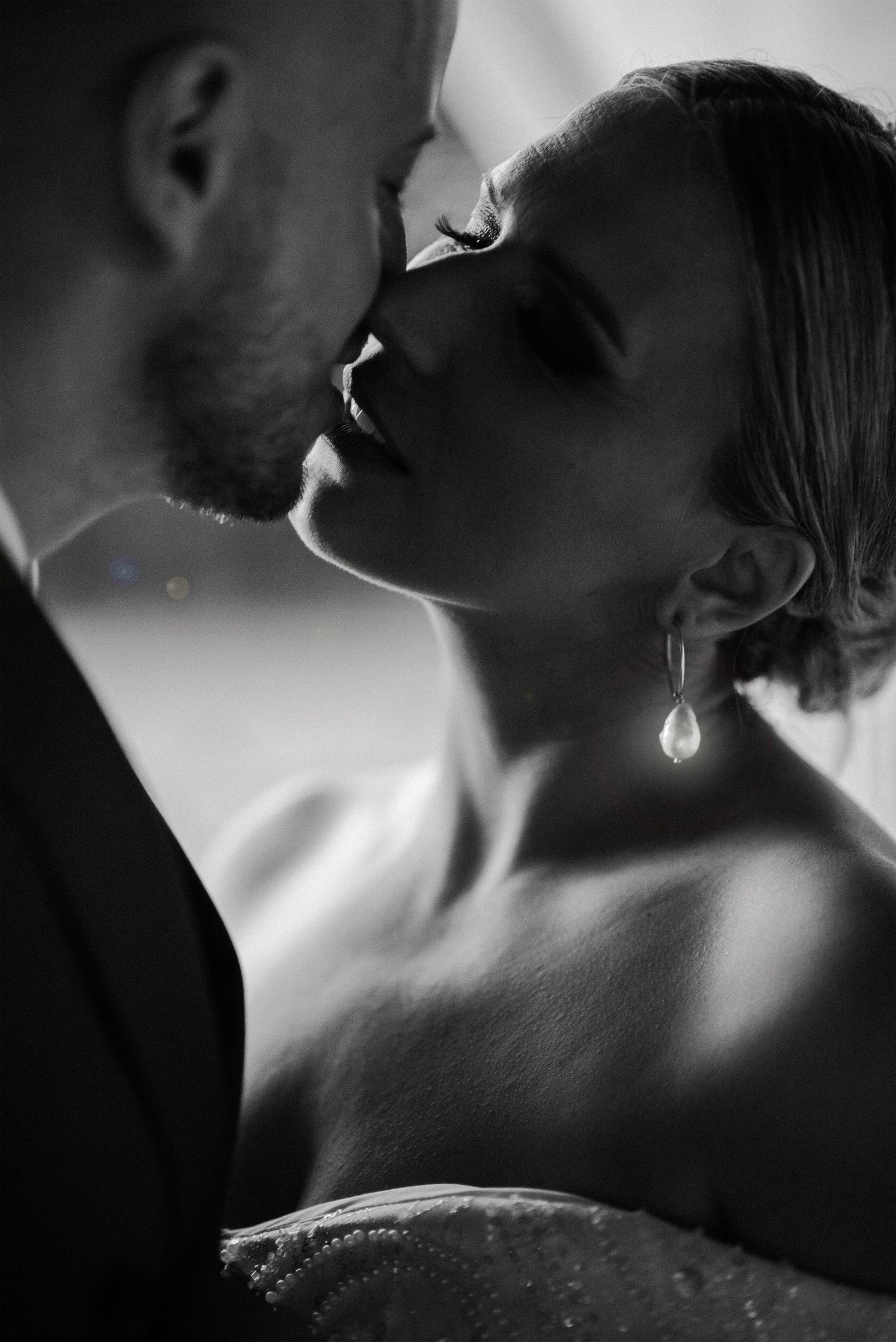 Black and white artistic photo series showing intimate close-up silhouettes in dramatic lighting and shadows.
