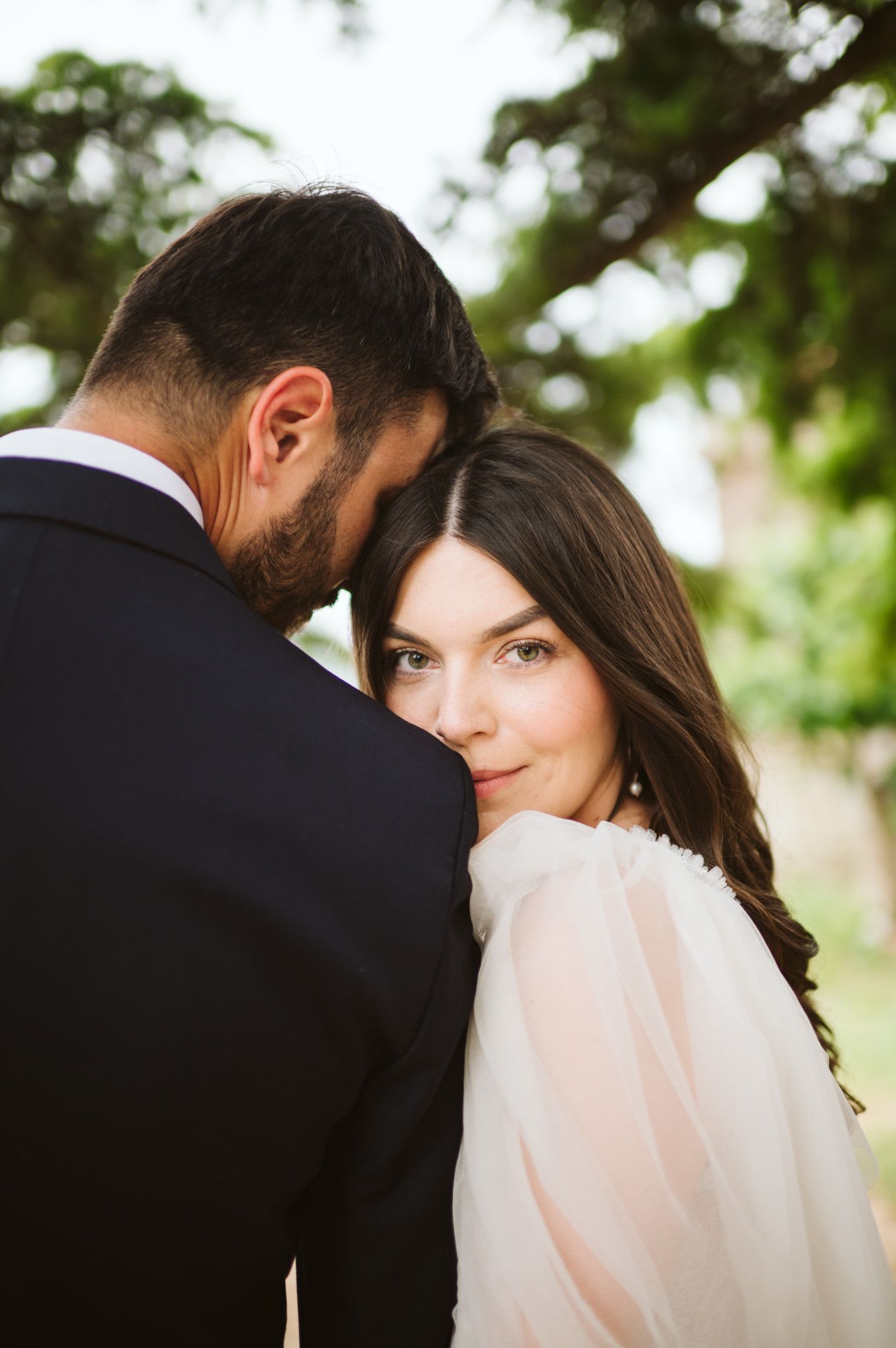 Romantic portrait session in natural light with soft focus background.