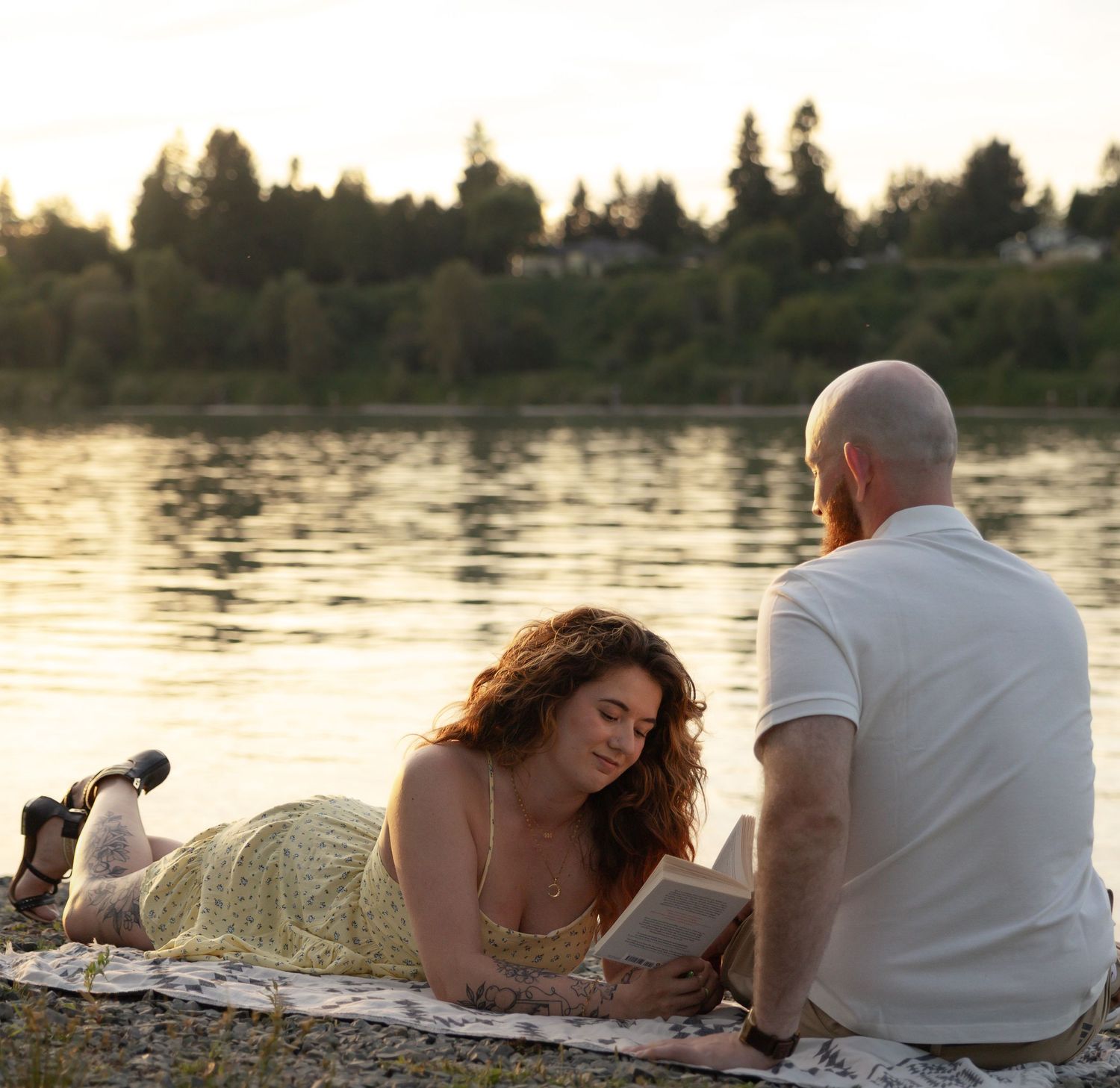 Romantic couples photography session by the lake at sunset, capturing genuine connection and natural emotion.