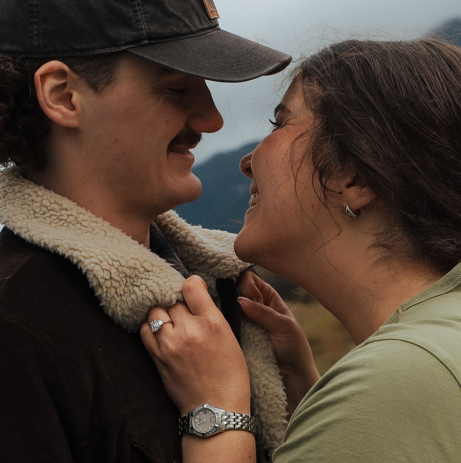 Romantic engagement session featuring a couple sharing a playful, intimate moment, photographed in British Columbia.