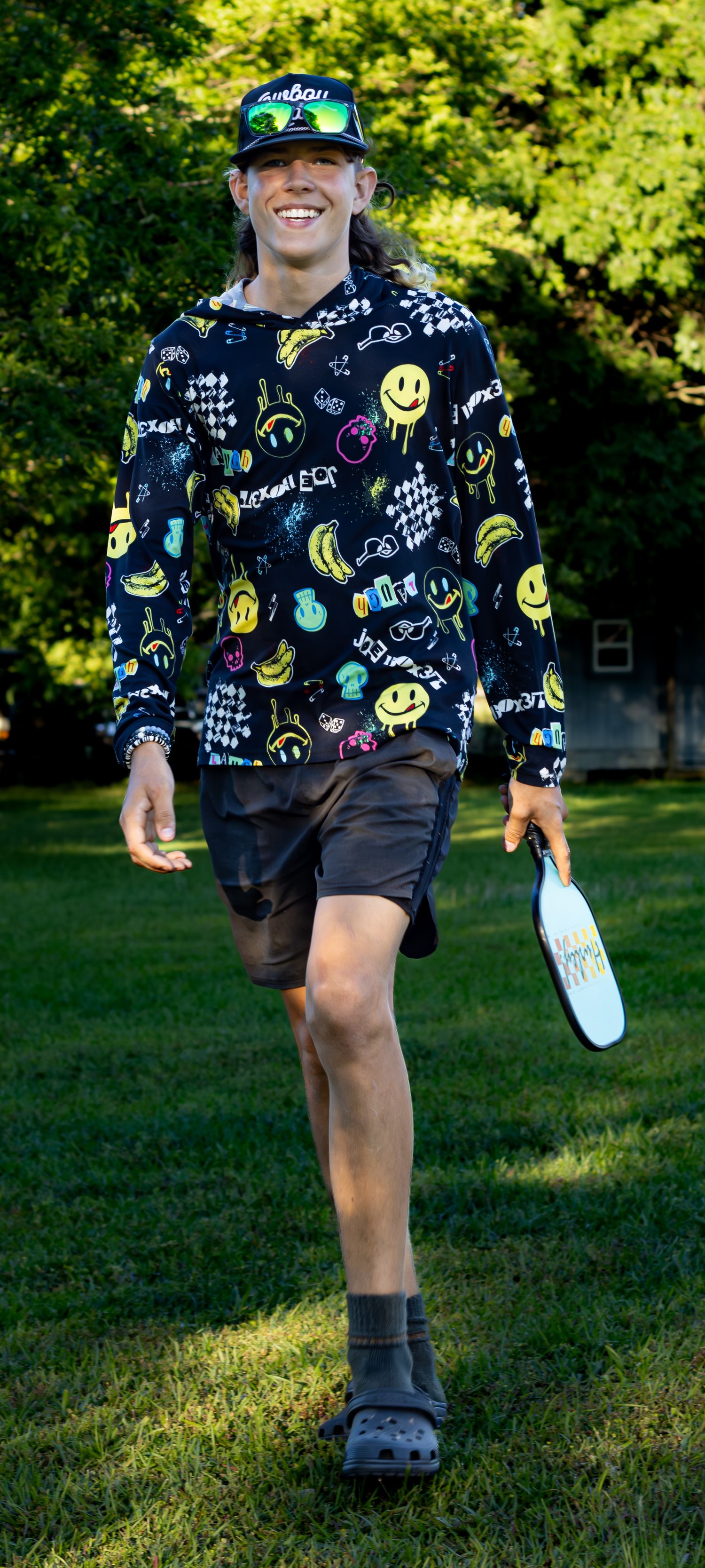 Candid family photos while playing a game of pickleball.