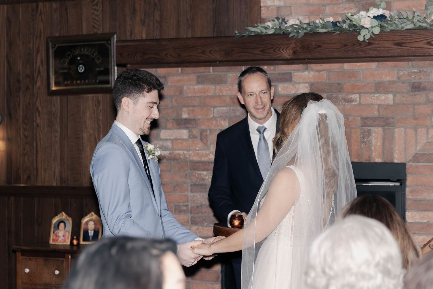A wedding ceremony sequence shows couple exchanging vows in front of brick walls and rustic decor.