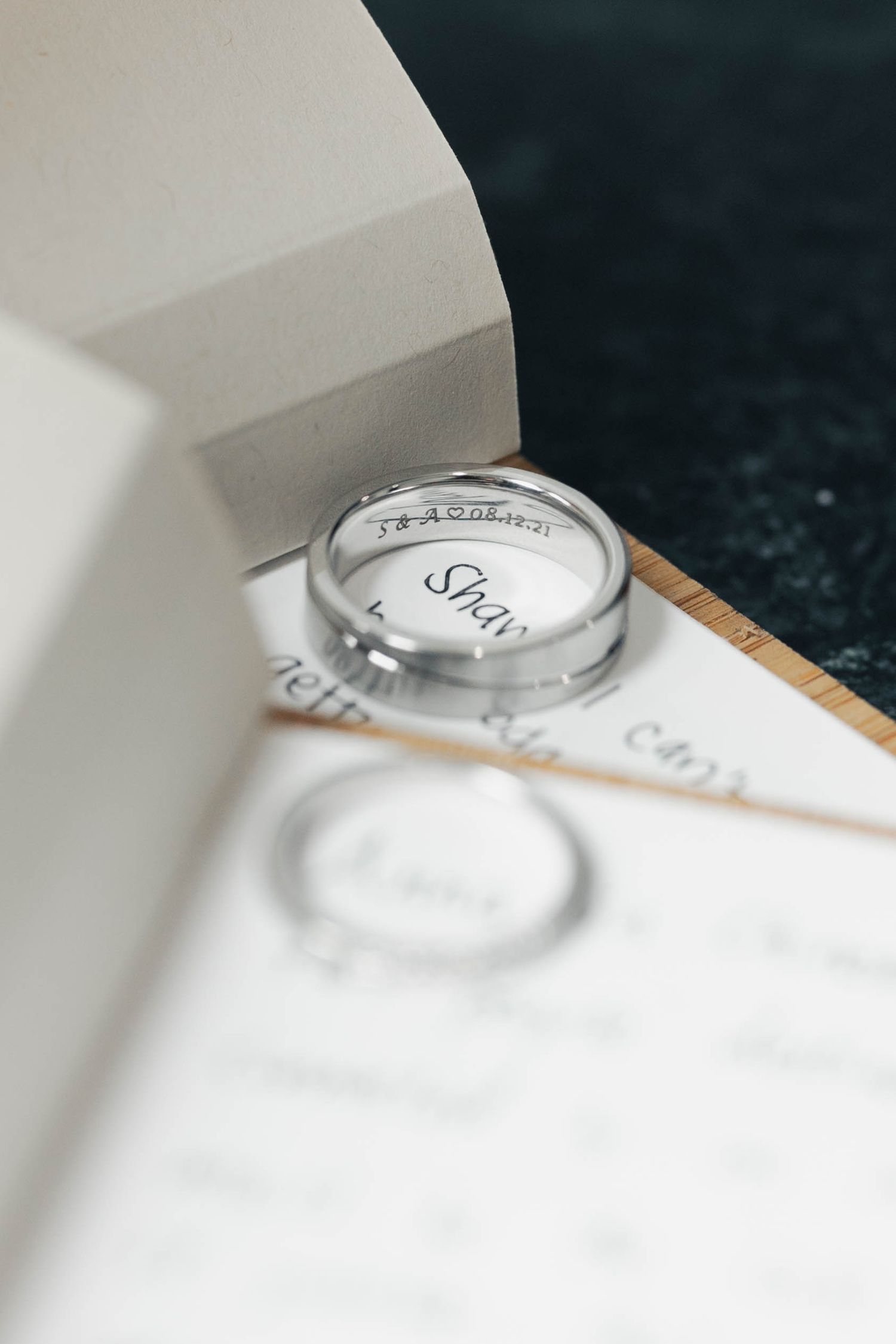 A series of close-up shots showing the edge of a white object against a dark background in a minimalist composition.