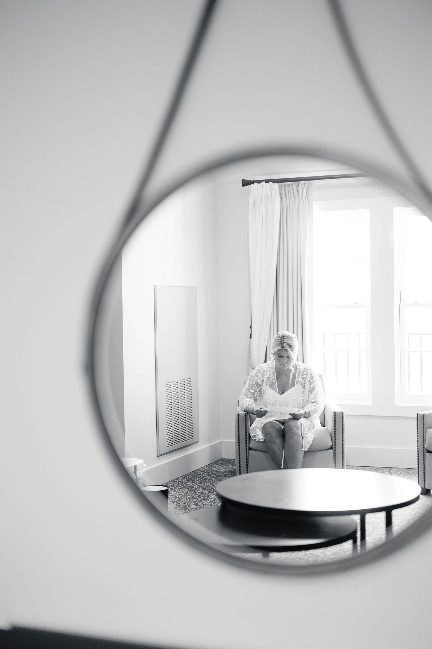Series of artistic mirror reflections capture wedding day preparations in black and white.